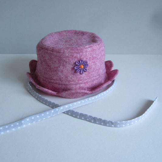 Kid's Hat Made of Raspberry Pink Felt with Grey and White Polka Dot Cotton Lining and Ties and a Daisy Applique Detail