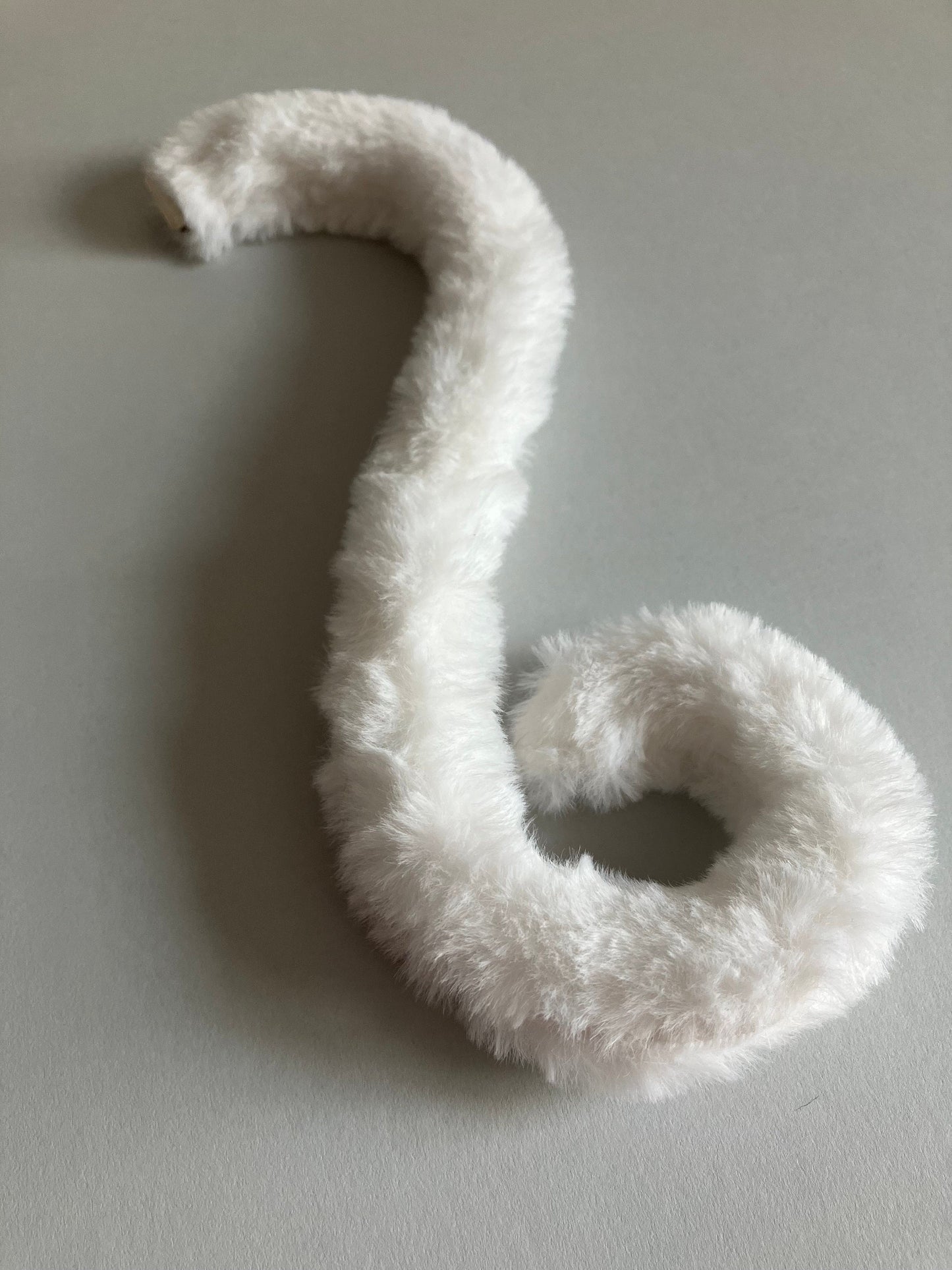 Clip on Cats Tail Made of White Faux Fur
