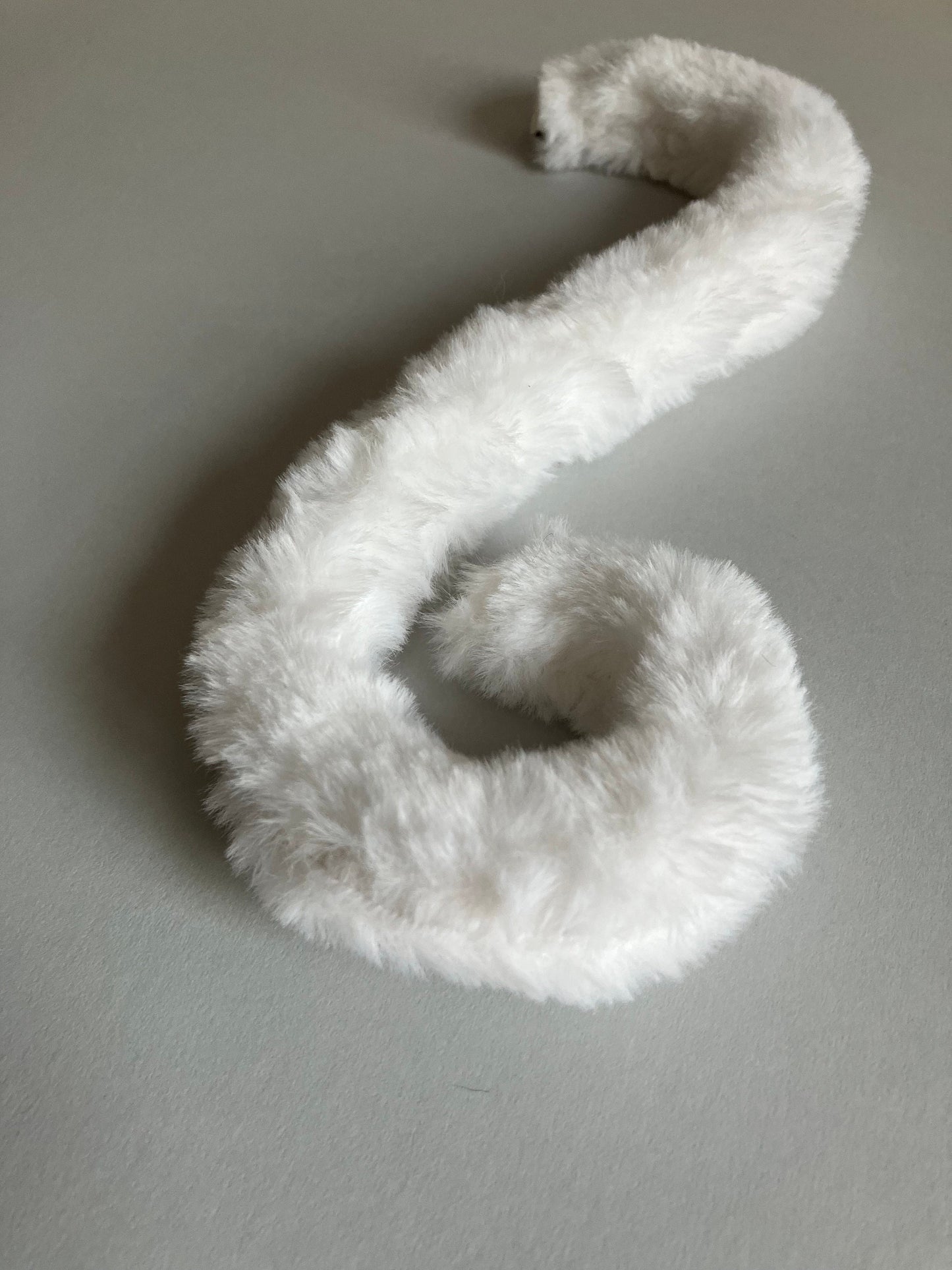 Clip on Cats Tail Made of White Faux Fur