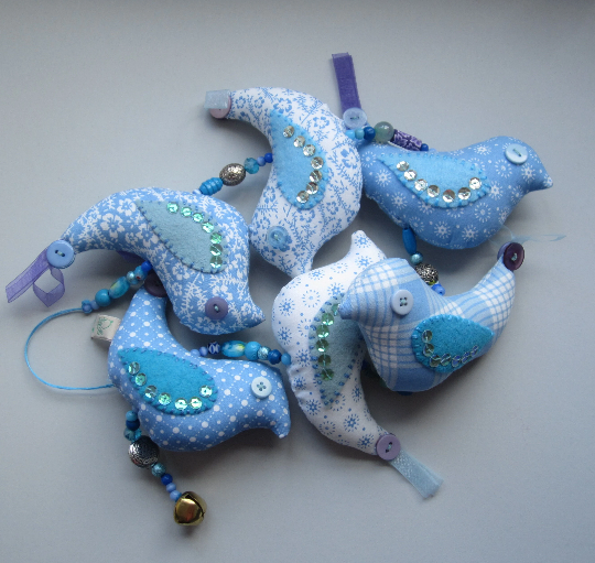 Mobile birds on a wire in cotton with beads, buttons, ribbon and a bell