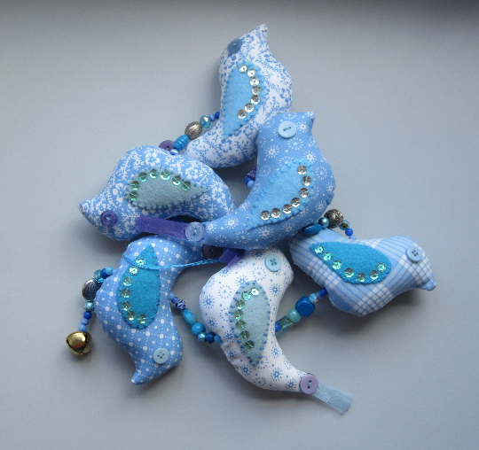 Mobile birds on a wire in cotton with beads, buttons, ribbon and a bell