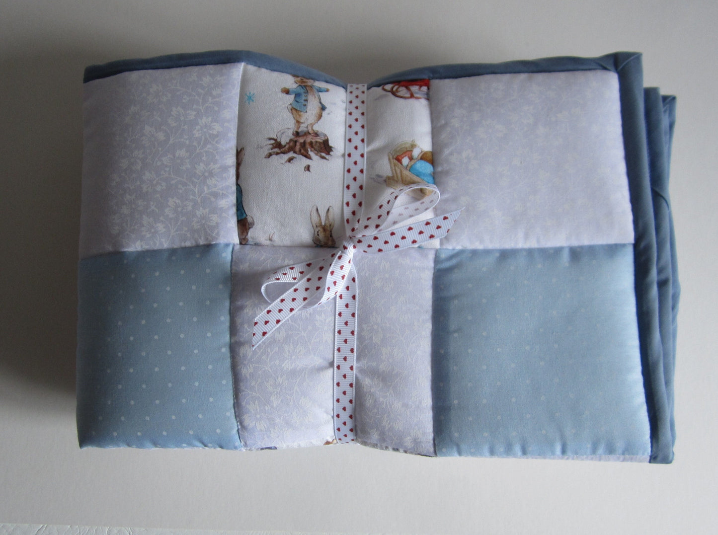 Newborn Baby Christmas Quilt Featuring Peter Rabbit, Benjamin Bunny and Robin Playing in the Snow